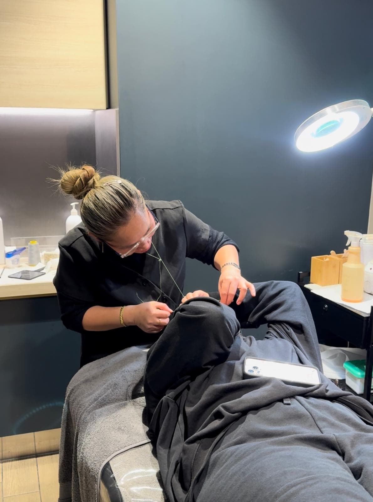 Threading treatment in progress at The Daily Cut