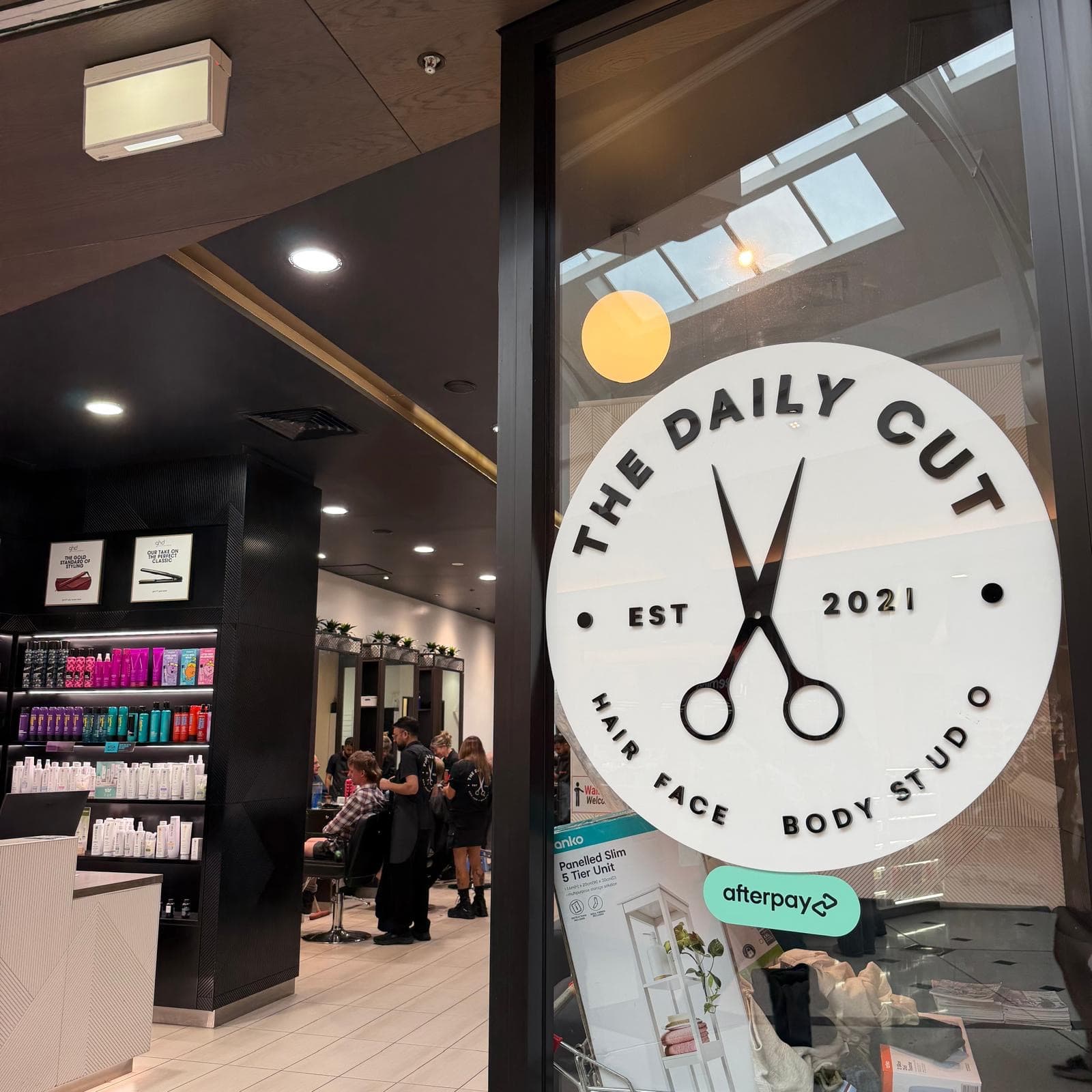The Daily Cut storefront sign